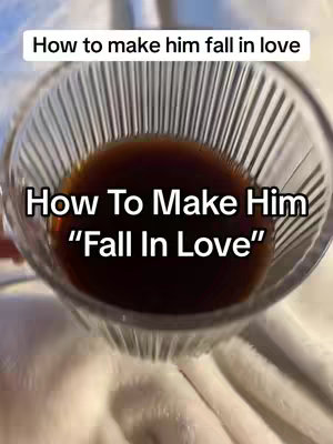 The image shows a close-up view looking down into a clear glass bowl. The bowl is filled with a dark brown liquid (perhaps a beverage). Two lines of white text are written on the cover overlay: "How to make him fall in love" above the glass, and "How To Make Him \"Fall In Love\"" below the glass. The background is a white, blurred surface, possibly a blanket or sheet.