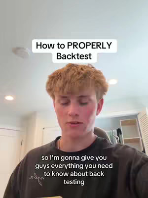 A young man with short, light brown hair is centered in the frame, appearing to be speaking directly to the camera. He is wearing a dark t-shirt. Above him, the words 'How to PROPERLY Backtest' are written in a bold, sans-serif font on a white background. Below him, the text 'so I'm gonna give you guys everything you need to know about back testing' is displayed in white on a black background. The background includes elements of a domestic interior, such as a white ceiling and a shelf.
