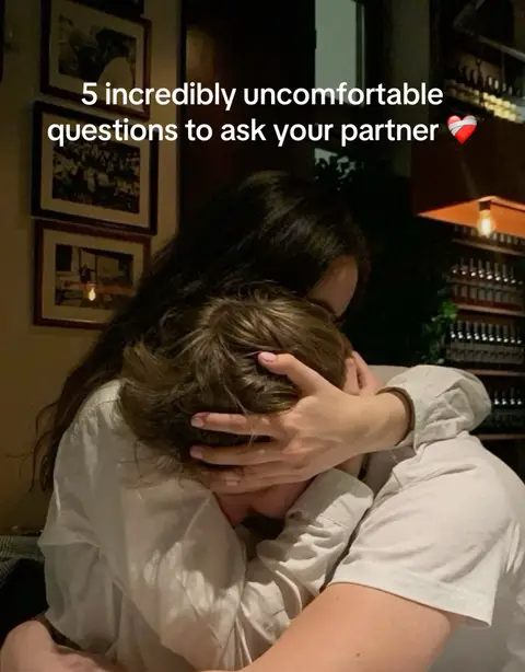 The cover image shows a couple embracing, with the female figure's arms wrapped around the male. The female figure's hands cover the eyes of the male, conveying intimacy and vulnerability. The setting appears to be a dimly lit restaurant, indicated by the wooden decor in the background.