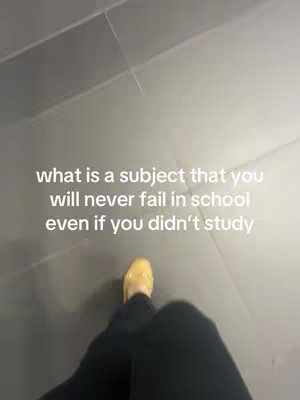 An overhead shot shows a person's legs and feet against a gray tile floor. The person is wearing black pants and yellow shoes. Text in white font is overlaid on the image.