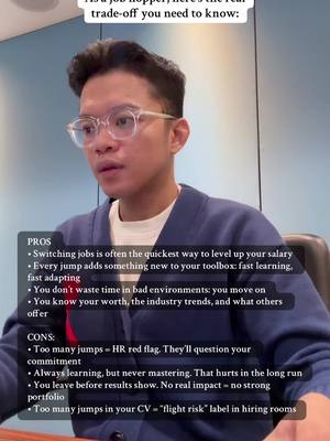 A man wearing glasses and a blue cardigan sits in front of a light background, looking down with a thoughtful expression. Text overlays detail the pros and cons of job hopping, with a list of bullet points.