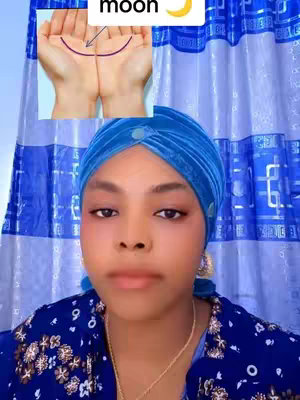 A selfie-style cover image features a young woman with a light complexion, wearing a vibrant blue headscarf and a blue floral top. She is centered in the frame, gazing directly at the viewer. Overlaid on the upper left side is a smaller image of open hands with lines drawn on the palms, presumably for palm reading, accompanied by a crescent moon graphic. The background consists of a blue curtain with patterned designs.