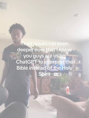 A man stands in front of a living room, the hook text says that people are using ChatGPT to interpret the Bible instead of the Holy Spirit