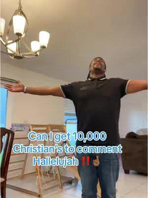 A man with his arms outstretched, smiling towards the ceiling in a well-lit room. Text overlays appear on in the lower third, promoting a request for interaction and conveying the message.