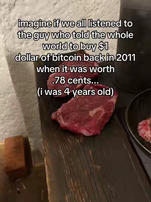 The image shows a close-up of a wooden surface with a piece of raw steak and text overlayed. The steak is red, with visible marbling, and is placed on the wood. Above and slightly to the left is the text overlay in white, which describes a hypothetical scenario regarding Bitcoin purchases. The composition is a high-angle shot.