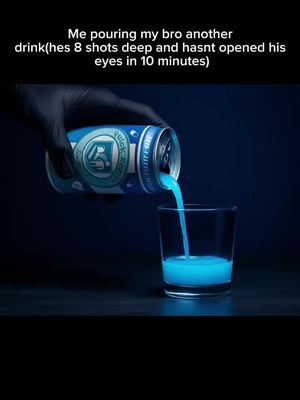 The image shows a dark, moody scene. A gloved hand pours a bright blue liquid from a can labeled 'Quick Revive' into a clear shot glass. The liquid stream glows, as does the liquid already in the glass, contrasting with the dark background. Above the can, text is present. The composition highlights the contrast with the dark background and the glowing liquid.