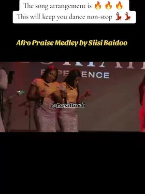 The cover image features a live performance with two women on stage. They are dressed in matching outfits, wearing yellow tops and patterned skirts. Text overlays at the top of the image provide the hook while the bottom displays social media references.