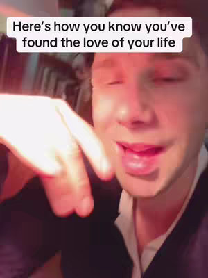 A man is speaking to the camera with a finger pointed down, with the text overlayed.