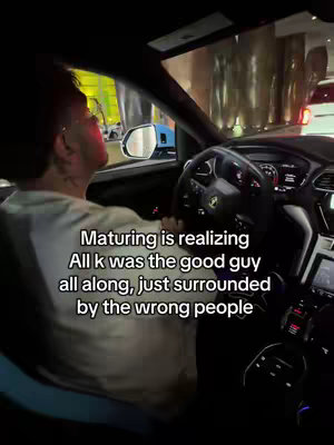 The cover image shows a man driving a luxury car. The man is wearing a white shirt and has tattoos on his neck. Overlayed text at the bottom of the image gives context.