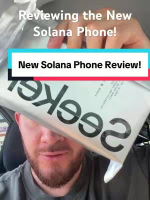A man is holding a white package with bold black text. Two colored banners are placed above and below the package. The man's face is partially visible.