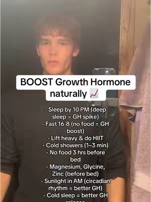 A man is filming himself in a bathroom or similar setting. He stands in front of a mirror, holding the phone to record. A white rectangular text overlay is above the phone, explaining how to boost growth hormone naturally. The image is lit fairly neutrally, the subject is caucasian, and the background is a bit blurry.
