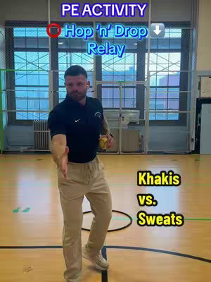 A man in a black shirt and tan pants with a yellow ball stands and holds out his hand towards the viewer. Text overlays indicate the activity and the teams.