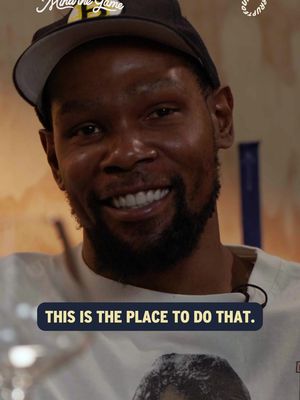 The cover image features a close-up of Kevin Durant, smiling and wearing a black cap. Text at the bottom reads 'THIS IS THE PLACE TO DO THAT.' The background is blurred, suggesting an interview setting.