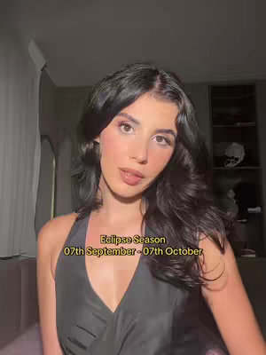 A woman with dark hair and makeup gazes at the camera. Text on the image indicates the start and end dates for Eclipse Season.