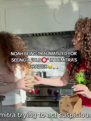 Two women are in a kitchen, one holding a green drink. Text overlays suggest a humorous scene involving a drawer and surprise.