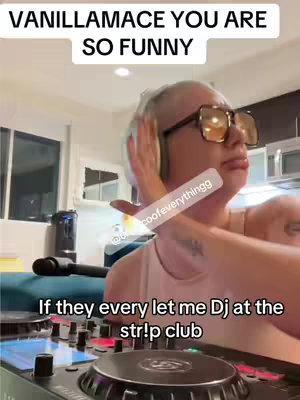 The image shows a woman wearing large sunglasses and headphones, with her hand covering one side of her face. Text overlays at the top and bottom provide context. The background suggests a kitchen setting.