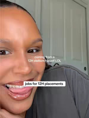 Close-up shot of a person's face, with a focus on the lower half. The person is looking off to the side, with the mouth open showing the tongue and teeth. Above the person, there's some skin with a little bit of hair.