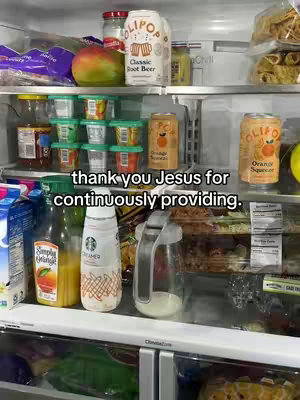 An open refrigerator filled with various food and beverages. In the top shelf, there's a large jar, drinks, and additional food containers are visible. The second shelf has more containers with drinks, including orange juice and creamer. The hook text "thank you Jesus for continuously providing" is overlaid on the image.