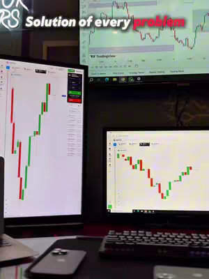 The cover image shows a dimly lit desk setup with multiple computer screens displaying trading charts. Two vertical monitors flank a horizontal one, all showing candlestick charts and trading platforms. A smartphone and keyboard are visible in the foreground.