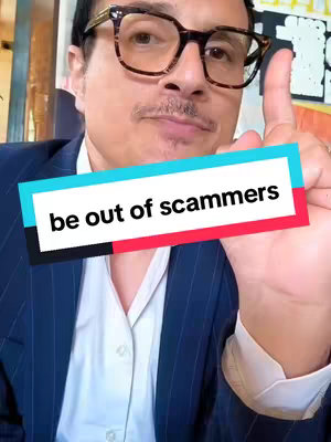 A man with glasses points upward with his right index finger. A text overlay reads 'be out of scammers'.