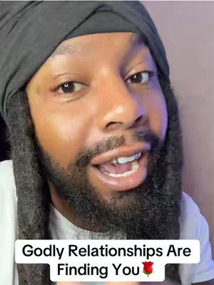 The cover image features a close-up of a Black man with a black turban and dreadlocks smiling and speaking. The text overlay reads 'Godly Relationships Are Finding You' in a white box at the bottom of the image, with a red rose emoji at the end.