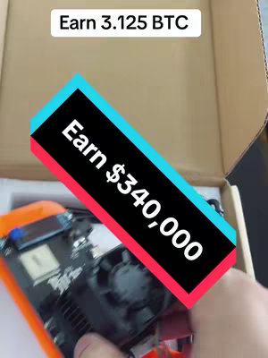 The image shows a hand holding a computer component inside a cardboard box. There are overlaid text elements with captions: 'Earn 3.125 BTC' and 'Earn $340,000'. The overall composition is product-focused.