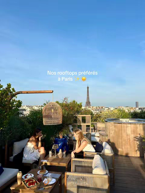 A rooftop scene in Paris with three people at tables, the Eiffel Tower in the background under a clear blue sky with a hook overlay.