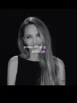 A grayscale image featuring a woman with long blonde hair, a dark top, and a slight smile. Overlay text in the middle reads "Gemini energy" with the Gemini symbol, and a smaller line mentions a social media handle.