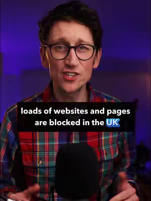 A man with glasses and a plaid shirt is speaking, with text overlayed on the image. The background is a gradient of purple and blue.
