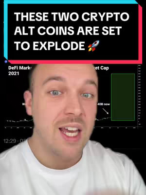 A man is speaking in front of a black background. He has light skin, short brown hair, and is wearing a white shirt. Above him is a rectangular box with red and blue sections, containing white text and a rocket ship graphic. Behind the man is a graph showing stock information.