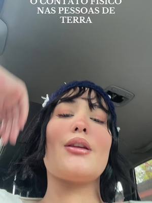 The cover image shows a person looking up at the camera from a low angle, likely inside a car. The individual has dark hair, a blue headband, and makeup. Text is overlaid at the top, while the person is the focal point of the image.
