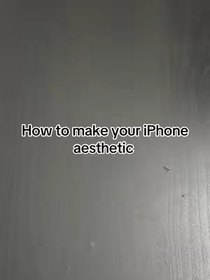 A vertical video cover image with a grey textured background. In the center is black text in a sans-serif font that reads "How to make your iPhone aesthetic."