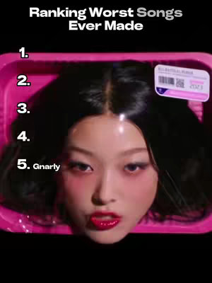 A close-up of a woman's face, appearing cut as if a head in a pink tray, with the numbers 1-5 and the word "Gnarly" written beside 5. The head has pale skin, dark hair, red eyeshadow, and a red lip color. The background is black.