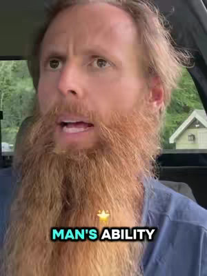 A man with a long red beard is sitting in what appears to be a car. The background is blurred, with trees and a small building visible. The man is speaking, and a text overlay reading "MAN'S ABILITY" appears at the bottom of the screen. The lighting seems natural, and the color palette is dominated by greens, blues, and reds.