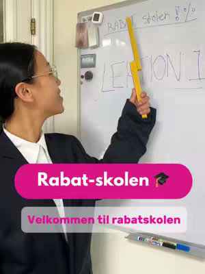 The cover image features a woman in a blazer and glasses. She points with a yellow ruler at a whiteboard. The board has handwritten text, and pink and white text overlays for the video title and call to action.