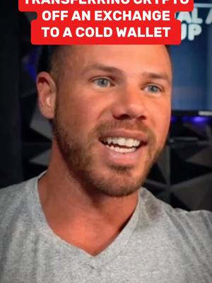A man with short hair and a beard is looking off to the side with a smile. Above him is a red banner with white text.