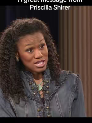 A woman with curly dark hair and dark skin is speaking into the camera. She is wearing a denim jacket and a necklace. Above her is the text "A great message from Priscilla Shirer."