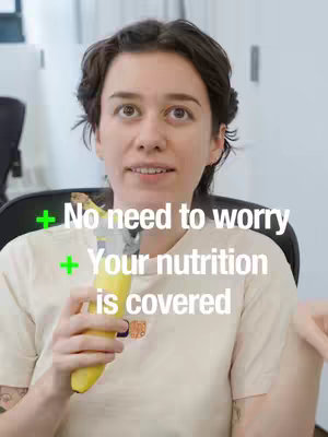 A woman is centered in the frame, looking up with a subtle smile, holding a banana. Text overlays state 'No need to worry' and 'Your nutrition is covered' with green checkmarks.