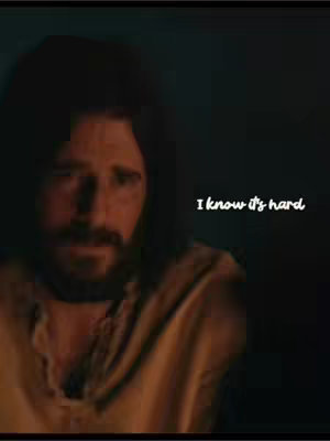 The cover image features a man with a beard and shoulder-length hair, illuminated from the side against a dark background. Above him, the text overlay reads, 'I know it's hard,' written in a white, handwritten-style font placed on the right side of the frame.
