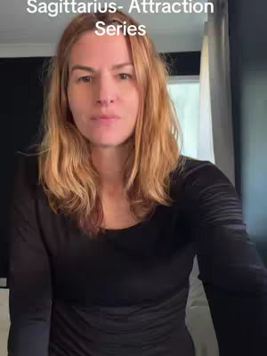 The cover image shows a woman with light brown hair, facing the camera with a neutral expression. She is wearing a black top. The text "Sagittarius- Attraction Series" is overlaid on the top of the image.