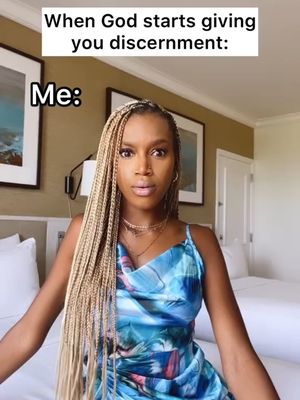 The cover image features a woman in a blue dress in a hotel room setting. The woman has light-colored braids, is looking in the camera with a surprised expression. Above her head is a text overlay, and in the background, there are two beds, a picture and a lamp.
