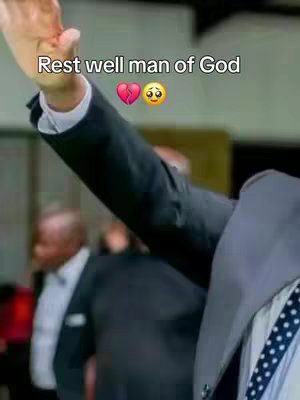 The image shows a person's raised arm, dressed in a suit, partially visible. The focus is on the arm and hand raised upwards. Text overlays on the image.