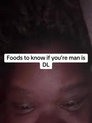 The cover image showcases a close-up view of a person's face, with the lower portion of the forehead, eyes, and a hint of the nose visible. The person's skin tone appears to be dark. The eyes are open and looking downwards. Above, a white text overlay provides the caption 'Foods to know if you're man is DL', with 'DL' on the subsequent line.