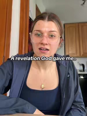 A young woman with glasses is centered in the frame, looking slightly upward. Text, "A revelation God gave me.." is overlaid. The background includes glimpses of a kitchen setting.