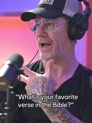 The image shows a man wearing a trucker hat, glasses, and headphones, holding a microphone. Text overlaid on the bottom reads, "What's your favorite verse in the Bible?"