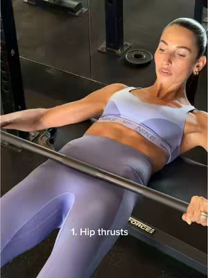 The cover image shows a woman in an athletic pose, lying on a workout bench. She's wearing a lilac sports bra and leggings, and is doing hip thrusts with a barbell. The shot is focused; the lighting is neutral.