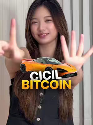 The cover image features a smiling woman with her hands up, framing a superimposed image of an orange toy car. Overlaid on the image of the car is the text "CICIL BITCOIN" in bold white letters outlined in black. The woman is fair-skinned with long brown hair.