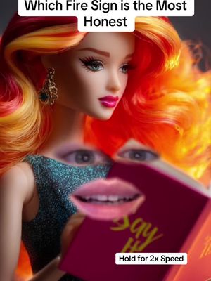 A doll with fiery red and yellow hair on an orange background. The doll has fair skin, bright pink lipstick, and is wearing a teal dress. Overlaid on the image are a pair of eyes and a mouth. The mouth is open. In the doll's hand is a red book with the white and yellow words, 'Say It!' There is superimposed text at the top which says 'Which Fire Sign is the Most Honest.' and the bottom of the image text reads 'Hold for 2x Speed'.