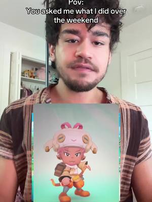 A selfie-style video where a man is looking at the camera with a game character displayed over the image. The game character is a small, animated figure holding a bow and arrow.