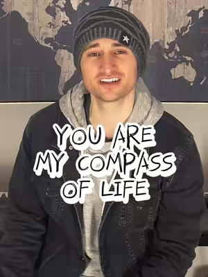 A man in a gray beanie and jacket is centered in a framed image. White text overlays the man, and a world map backdrop is visible.